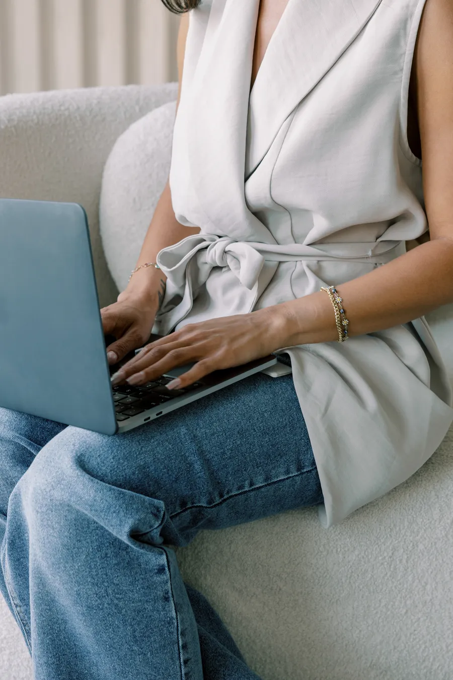 Close-up of a hand working on a laptop
